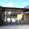 DDA-compliant access control entrance featuring speed gates and accessible pedestrian access lane