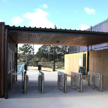 DDA-compliant access control entrance featuring speed gates and accessible pedestrian access lane